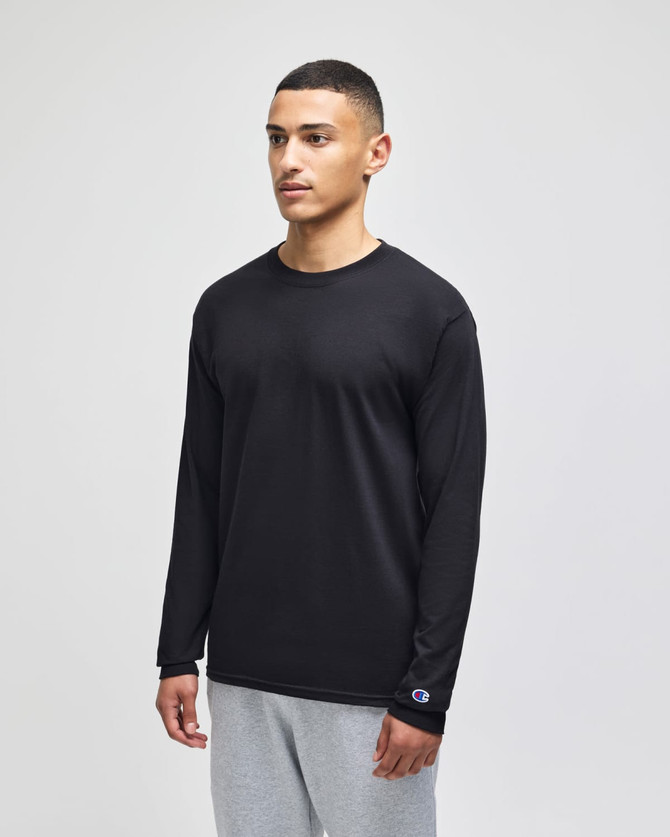 A black long-sleeve t-shirt displayed on a model, featuring a logo on one sleeve. 