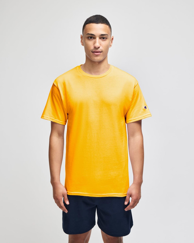 Adult jersey short sleeve t-shirt in vibrant yellow, featuring a logo on the sleeve, paired with navy shorts.