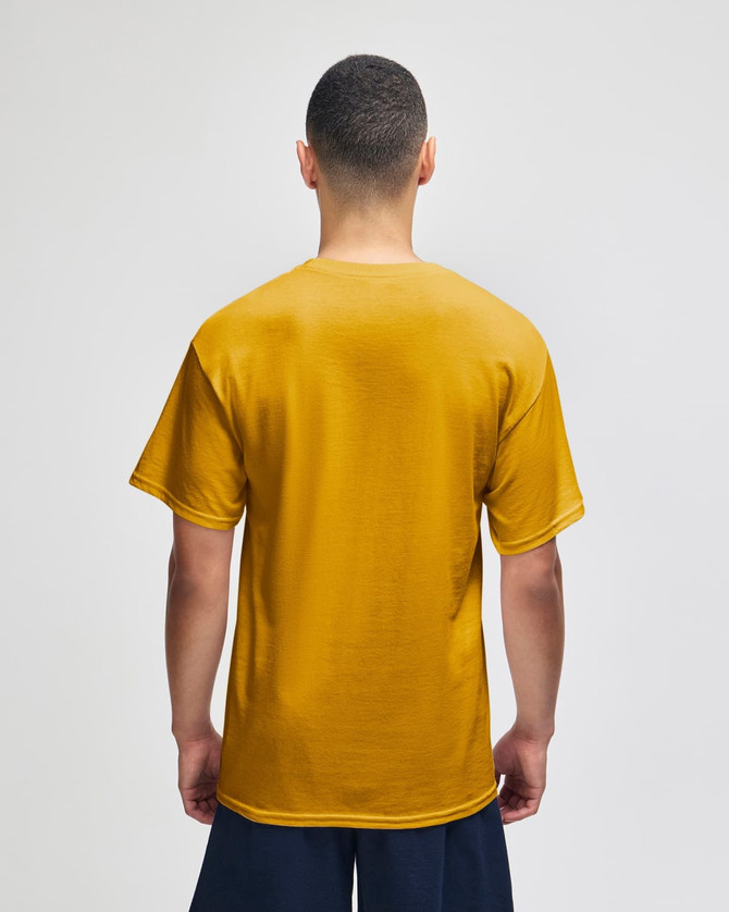 A back view of a mustard yellow short sleeve T-shirt on a model, featuring a logo on the upper back.
