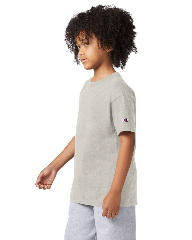A light grey short sleeve youth t-shirt with a logo on the sleeve, displayed on a model.