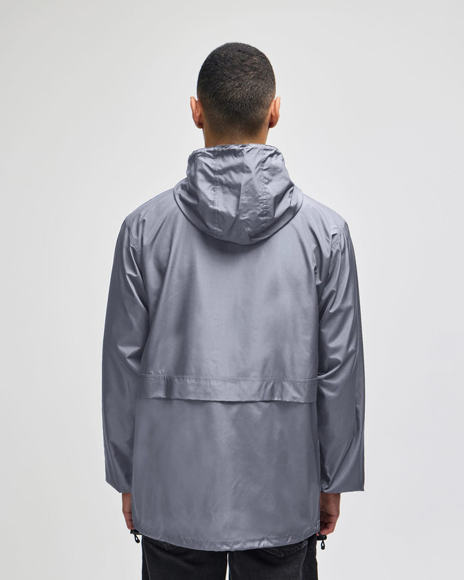 A man wearing a grey Champion Adult Full-Zip Anorak Jacket with a hood, viewed from the back.