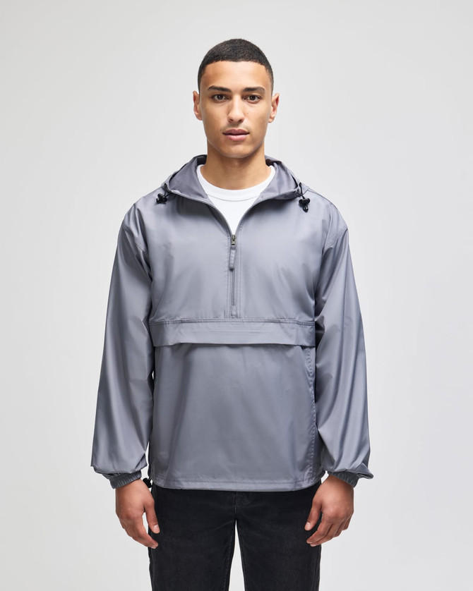 A grey packable anorak jacket with a hood, featuring a front pouch pocket and adjustable drawstrings.