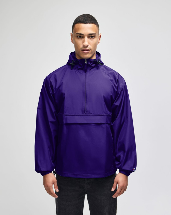 A purple packable anorak jacket with a front pocket and a hood, featuring a logo.