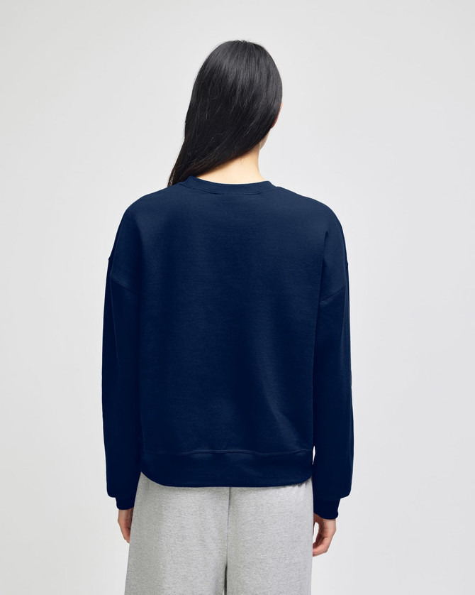 A navy crewneck sweatshirt with a relaxed fit, featuring a plain design and long sleeves.