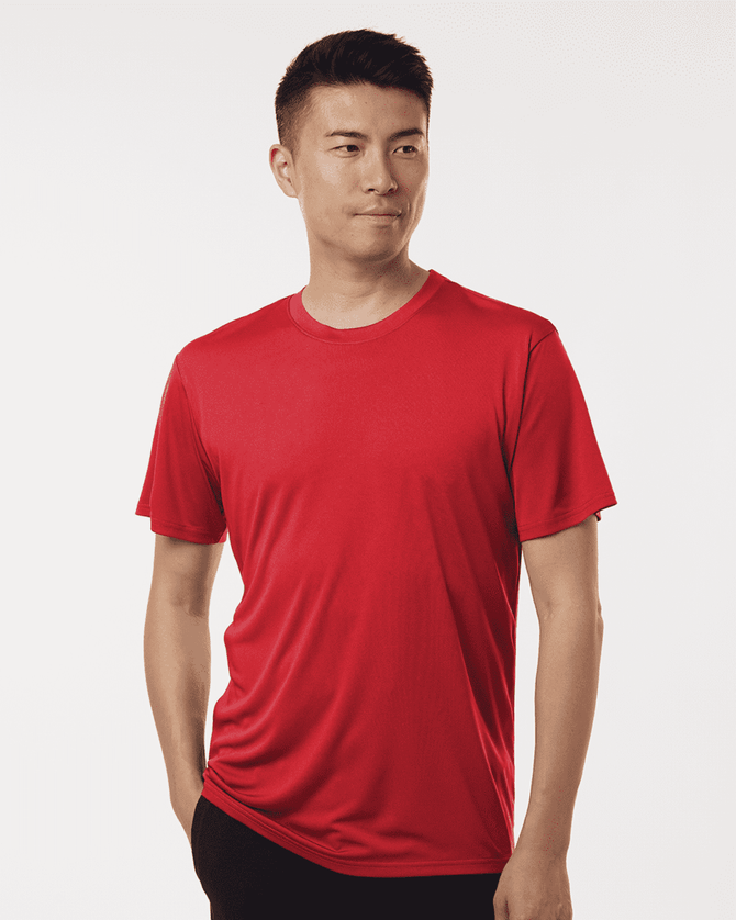 A red men's performance t-shirt displayed on a model, featuring a branded logo.