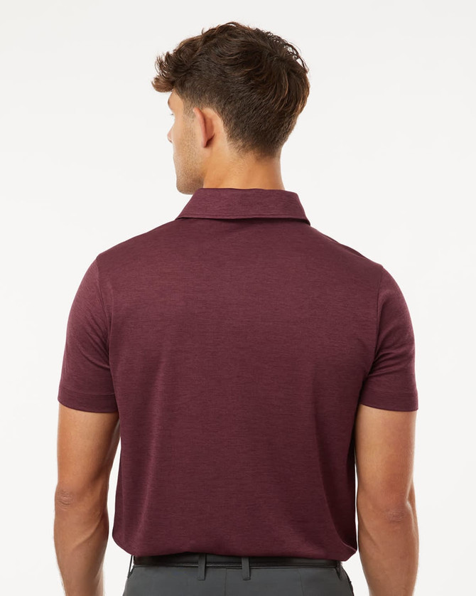 A men's short-sleeve polo in deep burgundy with a subtle heather pattern, featuring a collar and a logo.