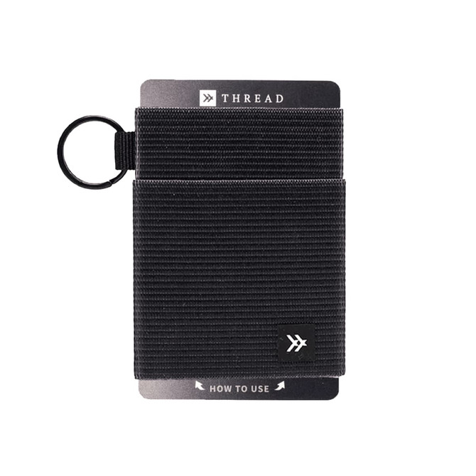 A black Thread Elastic Wallet features a textured design and includes a keyring attachment. It has a branding logo.