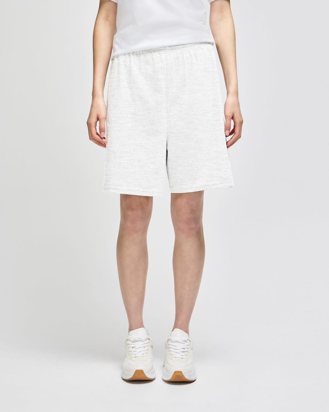 White cotton gym shorts with a relaxed fit and an elastic waistband, featuring branding.
