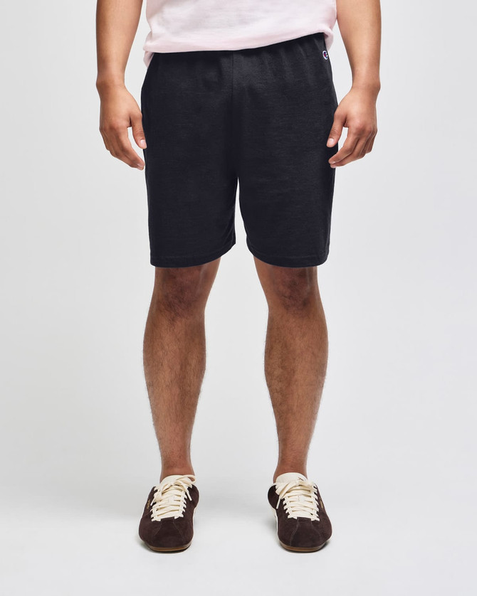 Cotton gym shorts in dark grey, featuring an elastic waistband and a logo on the side. Suitable for sports activities.