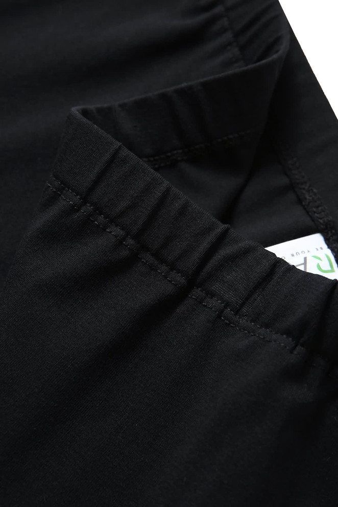 Black girl's cotton spandex shorts featuring an elastic waistband and a small tag.