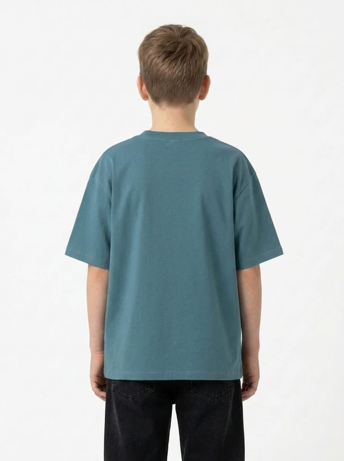 A back view of a kid wearing a faded teal 100% organic cotton t-shirt with short sleeves.