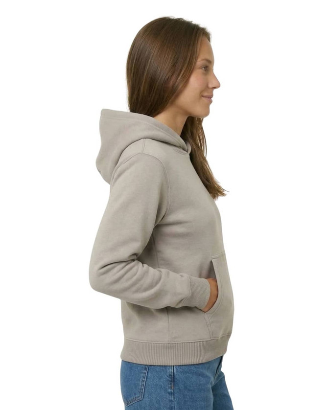 A grey women's kangaroo pocket hoodie featuring a hood and side pockets, displayed on a model from the side.