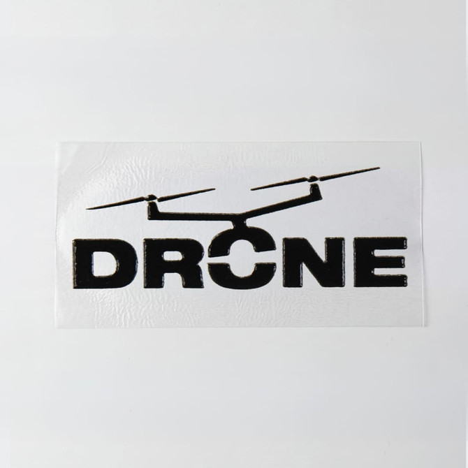 A 40 x 20mm sticker featuring a black drone graphic and the word "DRONE" on a white background.