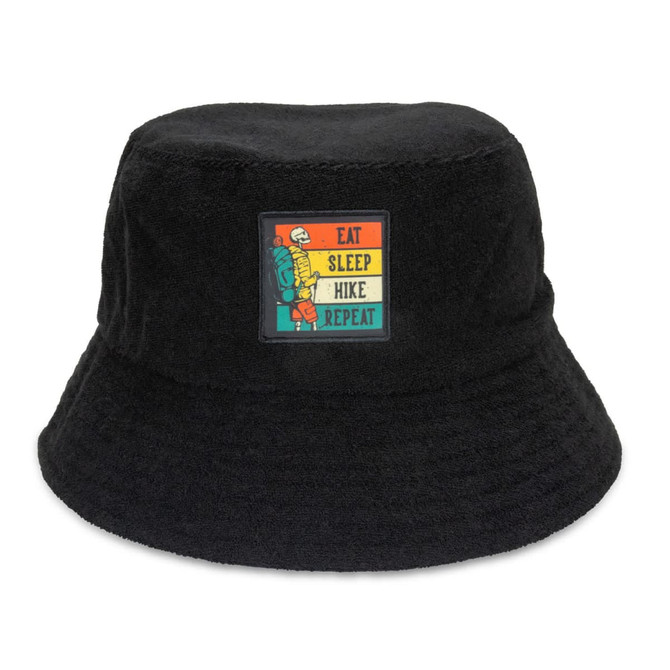 A black terry towelling bucket hat featuring a colourful patch with a hiking theme.