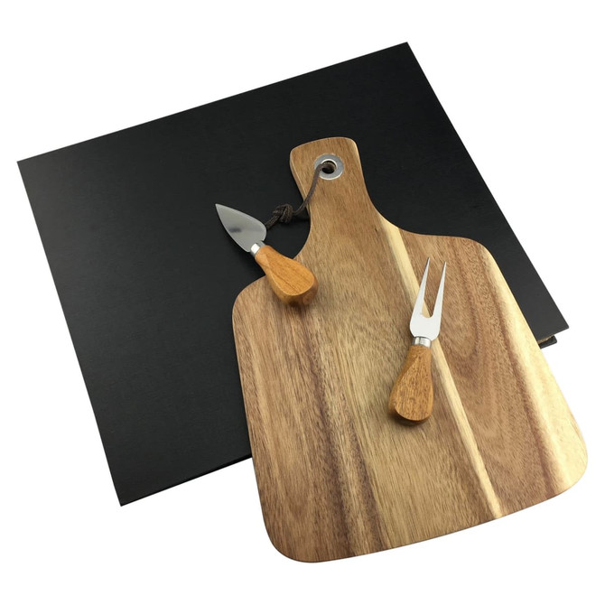 A wooden cheeseboard with two stainless steel knives and a black serving platter.