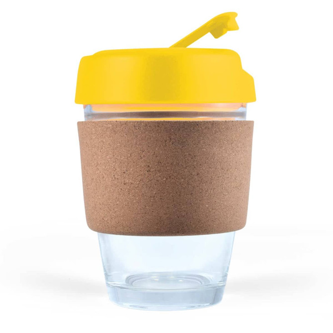 A reusable coffee cup with a transparent body, a cork band for insulation, and a bright yellow lid.