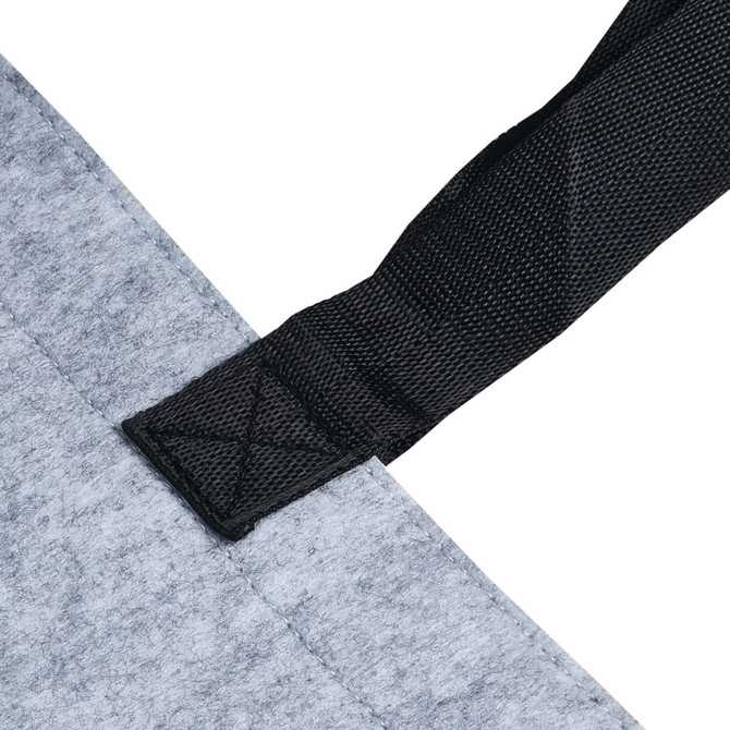 A grey felt tote bag with a black strap detail, featuring a simple attachment at the top.