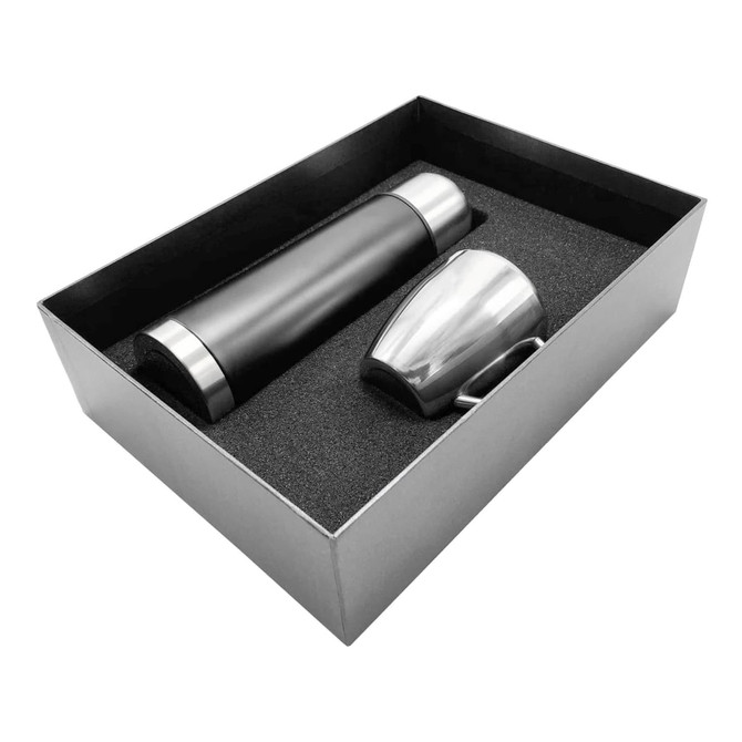 A drink bottle in black and a silver cup, both presented in a sleek gift box with foam cushioning.