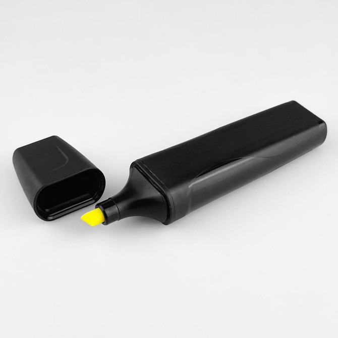 A black highlighter with a yellow tip, positioned next to its cap. The product features a simple design and branding.