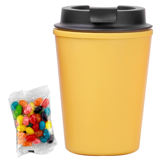A drink bottle in yellow with a black lid, accompanied by a pack of colourful jelly beans.