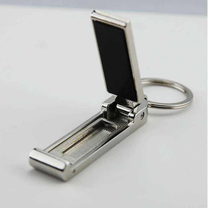A silver mobile stand and hanger key ring with a sleek, metal design and a black accent.