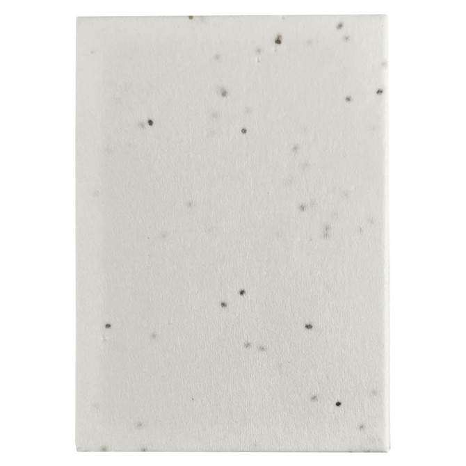 A sticky note pad with a speckled white design, featuring a plain cover and rectangular shape.