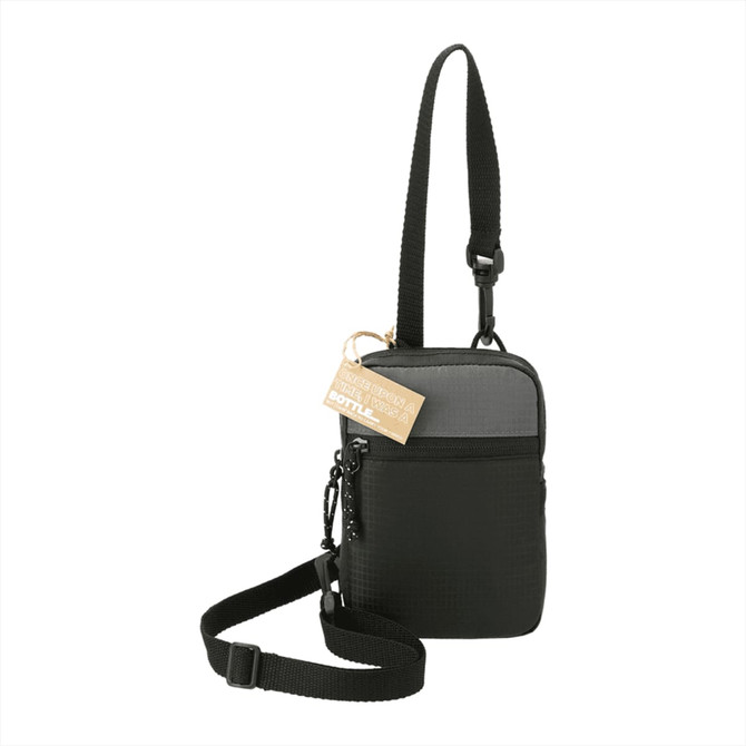 A black and grey crossbody pouch with an adjustable strap and a tag. It features a logo on the front.