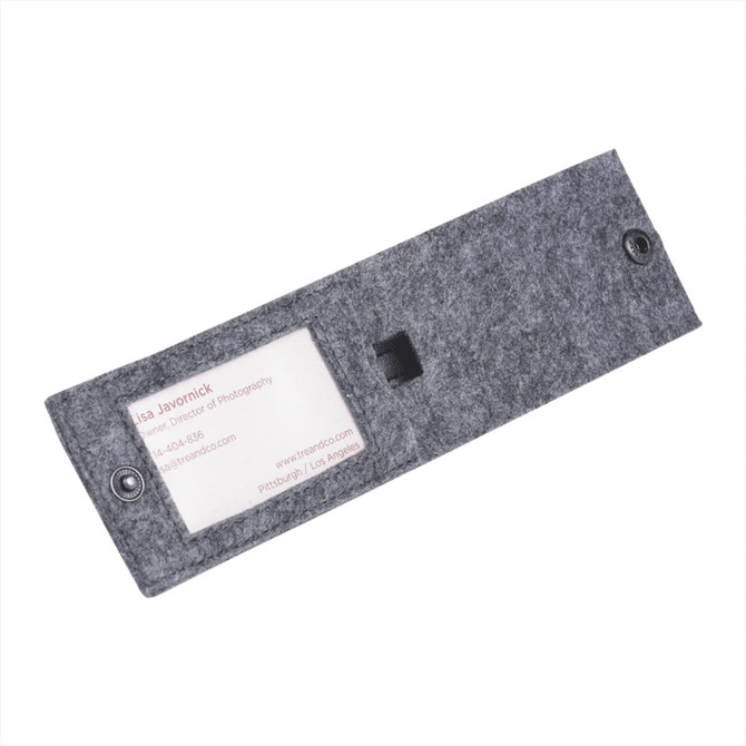 A grey recycled felt luggage tag with a transparent window for displaying information and a button closure.