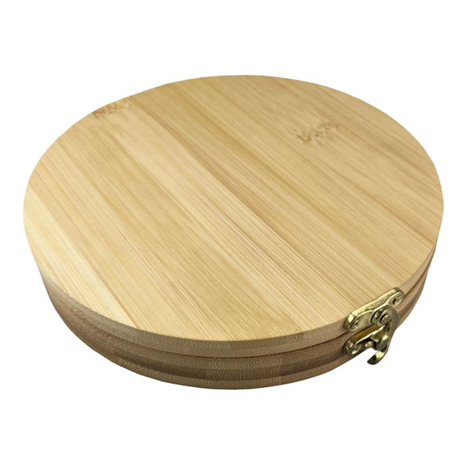 A round bamboo toolkit featuring a brass clasp, showcasing a natural wood finish.