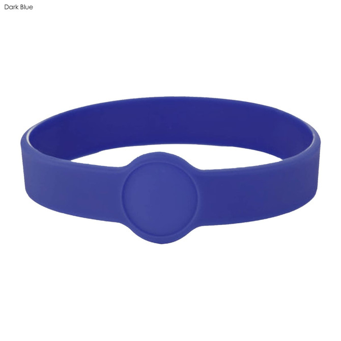 A dark blue silicone wristband featuring a circular design element. It includes a logo or branding.
