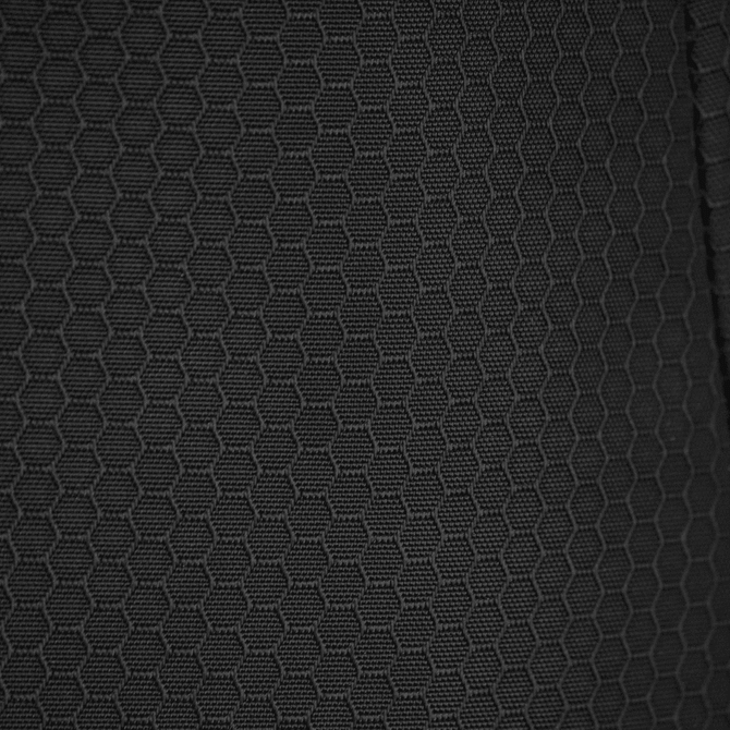 A textured black fabric featuring a hexagonal pattern, suitable for duffle bags and backpacks.
