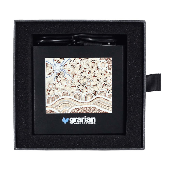 A black 3-in-1 charger with a patterned design, placed in a black cushioned box. Features a logo on the front.