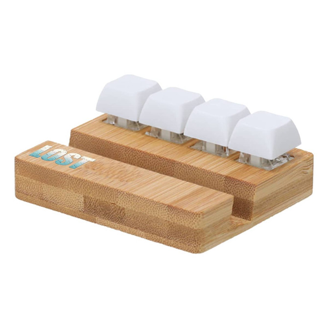 A bamboo stand featuring four white keyboard key stress relievers with a logo on the side.