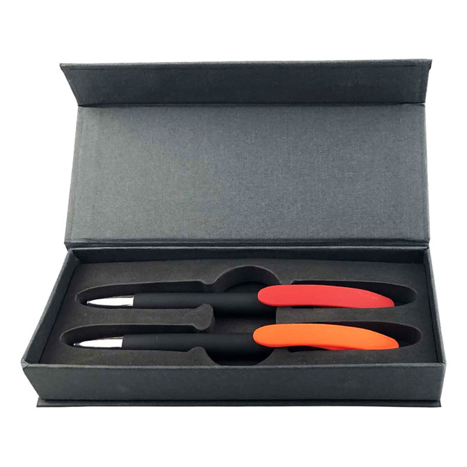 A gift set featuring two black pens with red and orange accents in a sleek grey box.