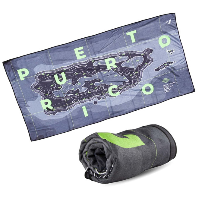 A blue and grey sand-free beach towel featuring a map design of Puerto Rico, folded beneath. It has a logo.