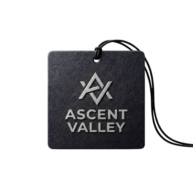 A car air freshener in a square design, featuring a black background and a logo in a silver finish.