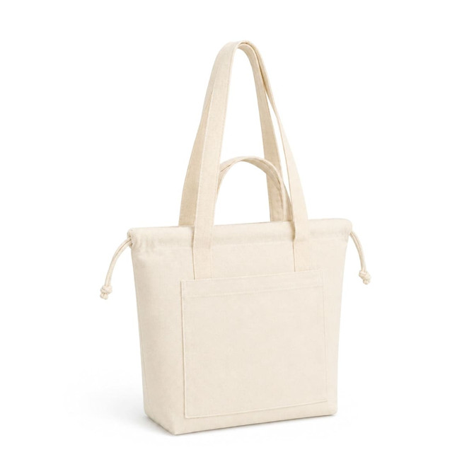 A cream-coloured tote bag with long straps and a front pocket, featuring a logo.