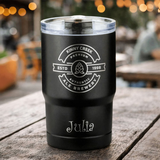 A drink bottle with a black finish, featuring a logo and a clear lid, set on a rustic table.