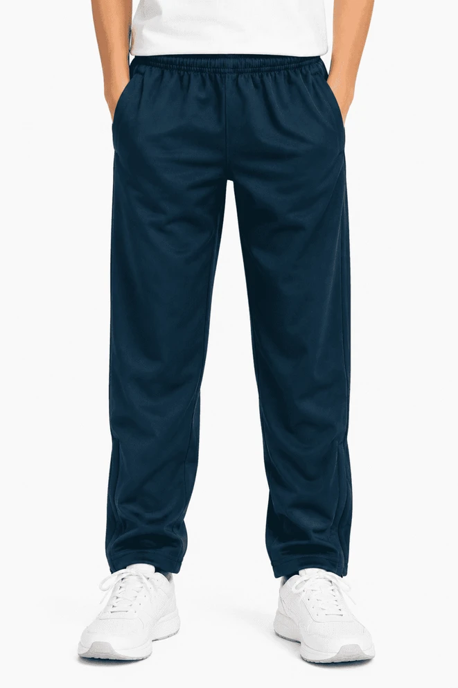 Navy track pants for kids with an elastic waistband and side pockets, featuring a logo on the front.