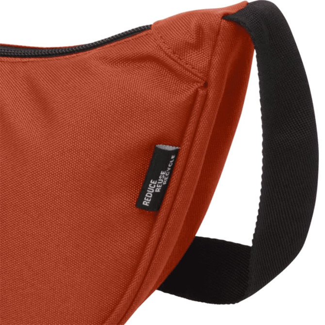 An orange waist bag with a black strap and a branding label on the side.
