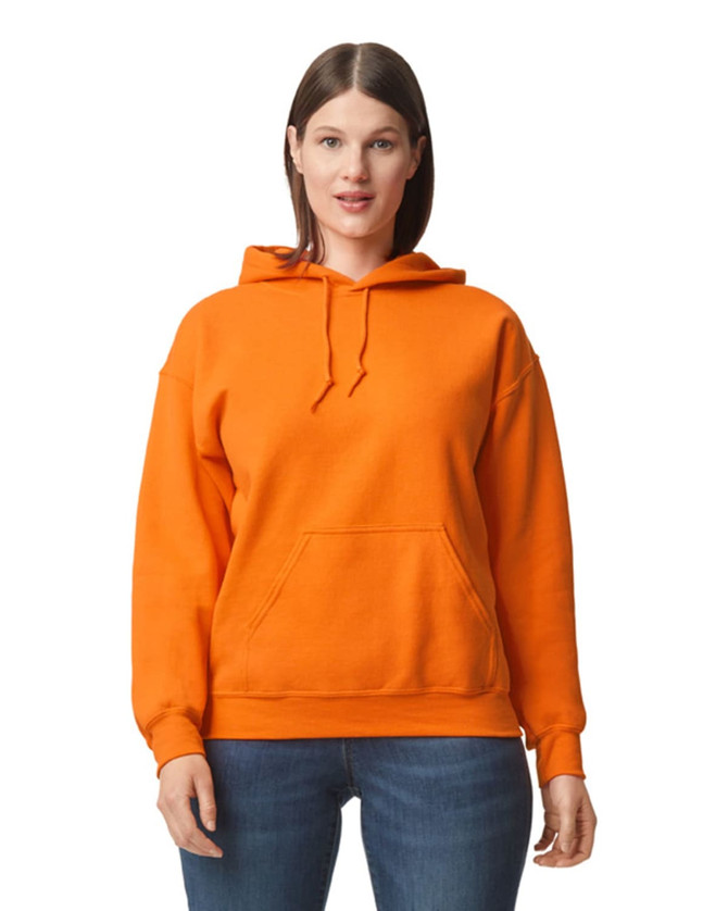 An orange hooded sweatshirt with a front pocket and drawstring hood, worn by a model. Features a logo.