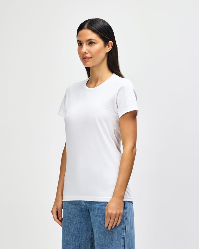 A white midweight ladies t-shirt displayed on a model, featuring short sleeves and a casual fit.