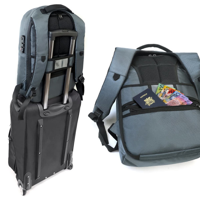 A grey backpack with adjustable straps, featuring a trolley handle and a pocket containing a passport and cash.
