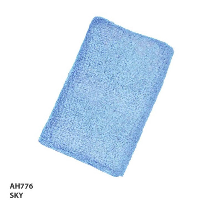 A soft blue towel displayed against a white background, featuring a textured surface. It has a branding logo.