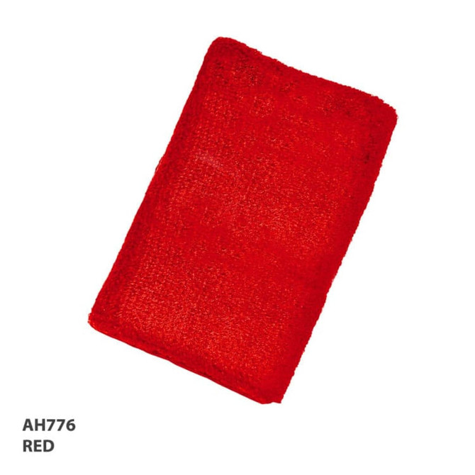 A red wrist band made from textured material, featuring a logo.