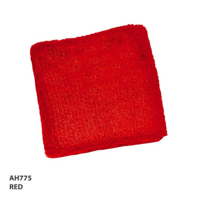 A red wristband made from a textured material, featuring a logo or branding.