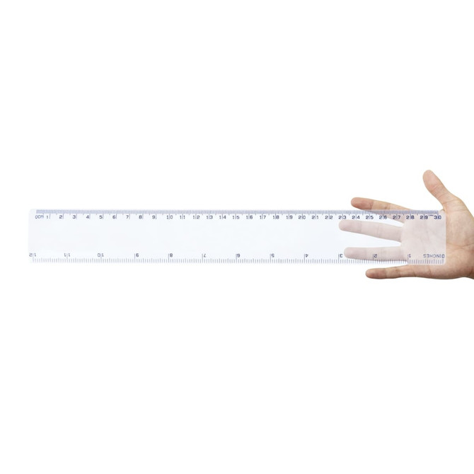 A transparent 30cm ruler held in a hand, featuring measurements in centimeters and inches.