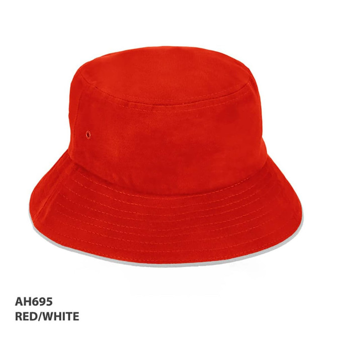 A red and white bucket hat with a branded logo, showcasing a classic design and wide brim.