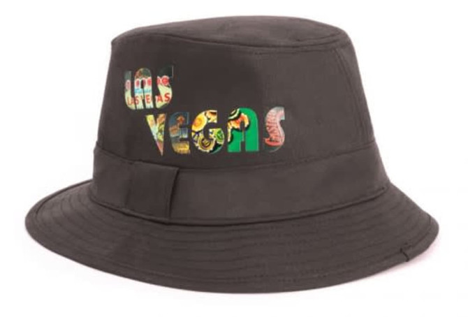 A black Trilby hat featuring colourful text that spells "Las Vegas." It includes a wide brim and a band.