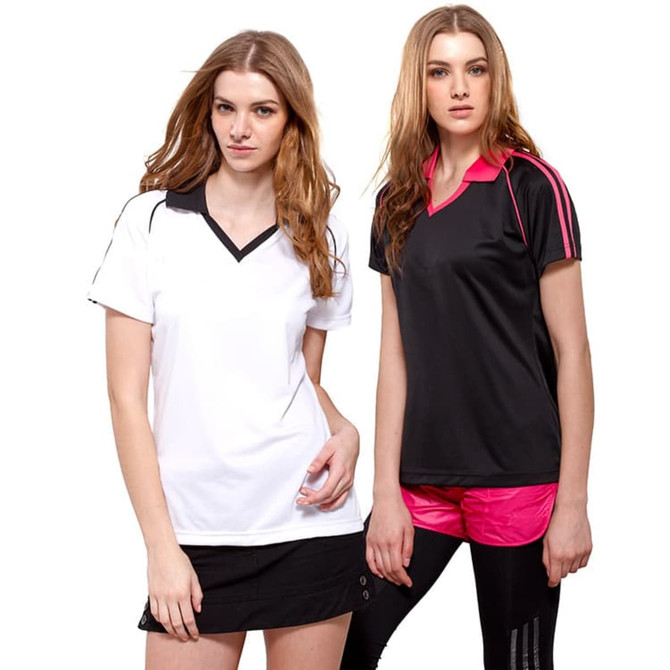 Two women wearing polo shirts, one in white with black accents and the other in black with pink accents.